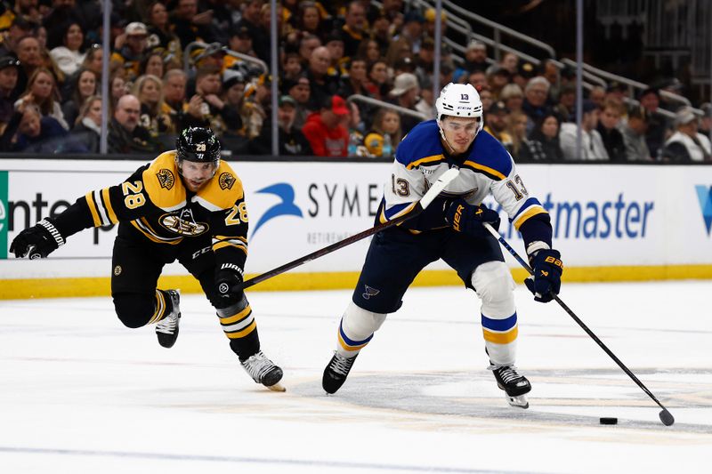 Nov 16, 2024; Boston, Massachusetts, USA; Boston Bruins center Elias Lindholm (28) tries to catch up with St. Louis Blues right wing Alexey Toropchenko (13) during the second period at TD Garden. Mandatory Credit: Winslow Townson-Imagn Images