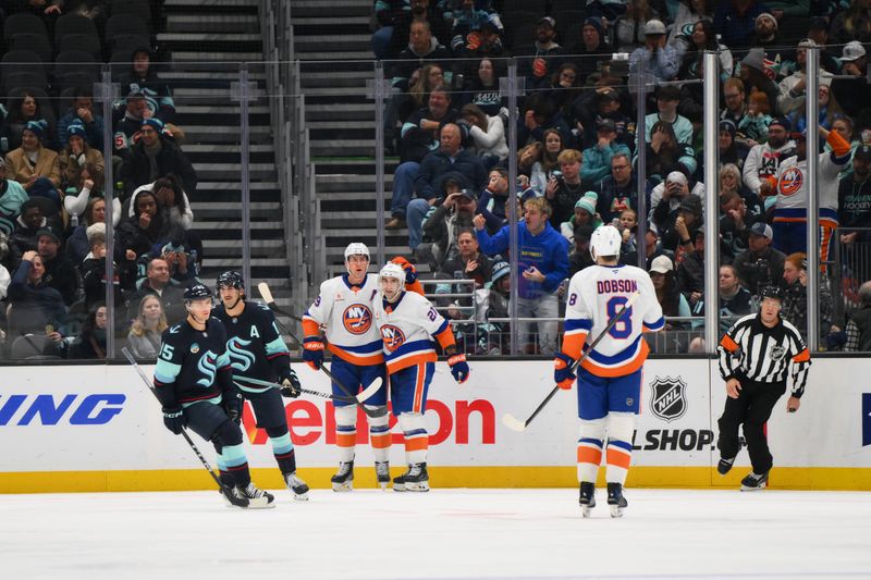 Nov 16, 2024; Seattle, Washington, USA; The New York Islanders celebrate after a goal scored by center Brock Nelson (29) during the third period against the Seattle Kraken at Climate Pledge Arena. Mandatory Credit: Steven Bisig-Imagn Images