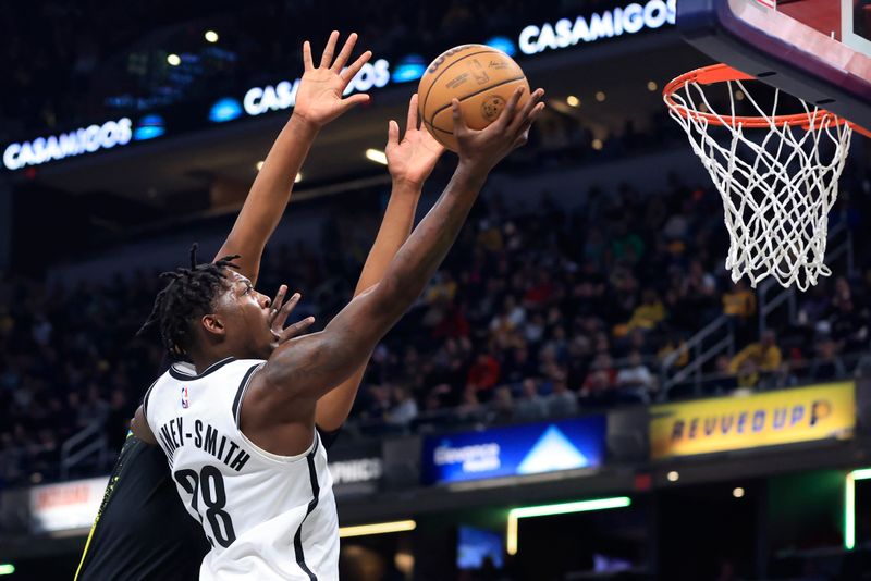 INDIANAPOLIS, INDIANA - MARCH 16: Dorian Finney-Smith #28 of the Brooklyn Nets takes a shot  during the first half in the game against the Indiana Pacers at Gainbridge Fieldhouse on March 16, 2024 in Indianapolis, Indiana. NOTE TO USER: User expressly acknowledges and agrees that, by downloading and or using this photograph, User is consenting to the terms and conditions of the Getty Images License Agreement. (Photo by Justin Casterline/Getty Images)