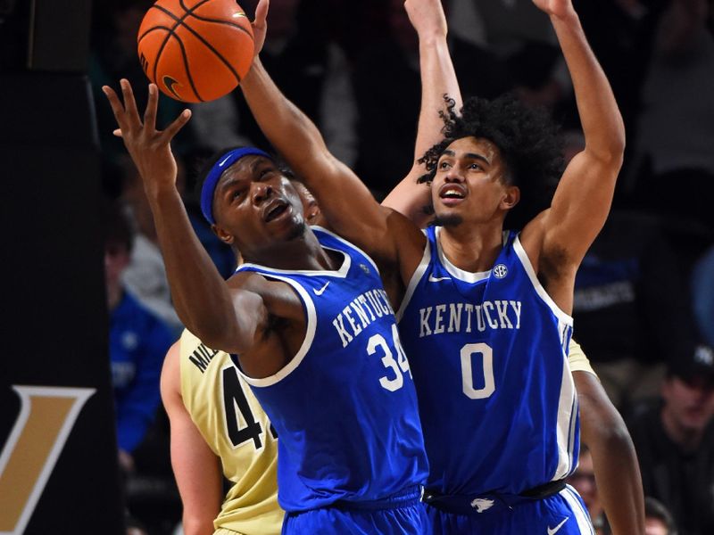 Jan 24, 2023; Nashville, Tennessee, USA; Kentucky Wildcats forward Oscar Tshiebwe (34) and teammate forward Jacob Toppin (0) work for a rebound during the second half against the Vanderbilt Commodores at Memorial Gymnasium. Mandatory Credit: Christopher Hanewinckel-USA TODAY Sports