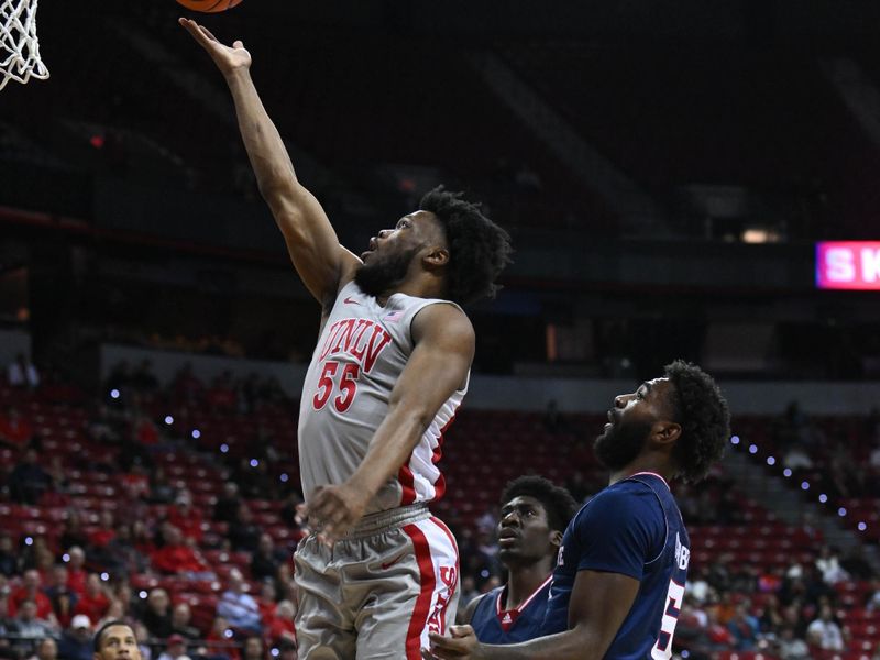 Feb 3, 2023; Las Vegas, Nevada, USA; UNLV Runnin' Rebels guard EJ Harkless (55) attempts to score on Fresno State Bulldogs guard Jordan Campbell (5) in the first half at Thomas & Mack Center. Mandatory Credit: Candice Ward-USA TODAY Sports