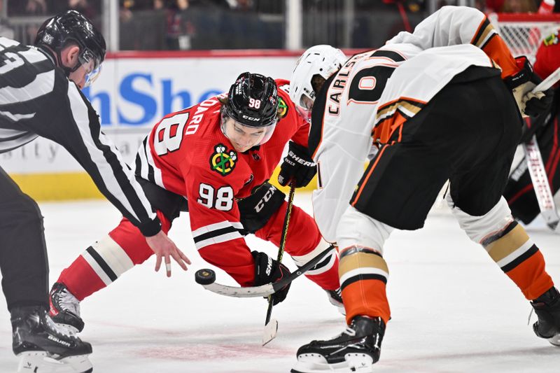 Dec 7, 2023; Chicago, Illinois, USA; Chicago Blackhawks forward Connor Bedard (98) takes a face off against Anaheim Ducks forward Leo Carlsson (91) in the second period at United Center. Mandatory Credit: Jamie Sabau-USA TODAY Sports