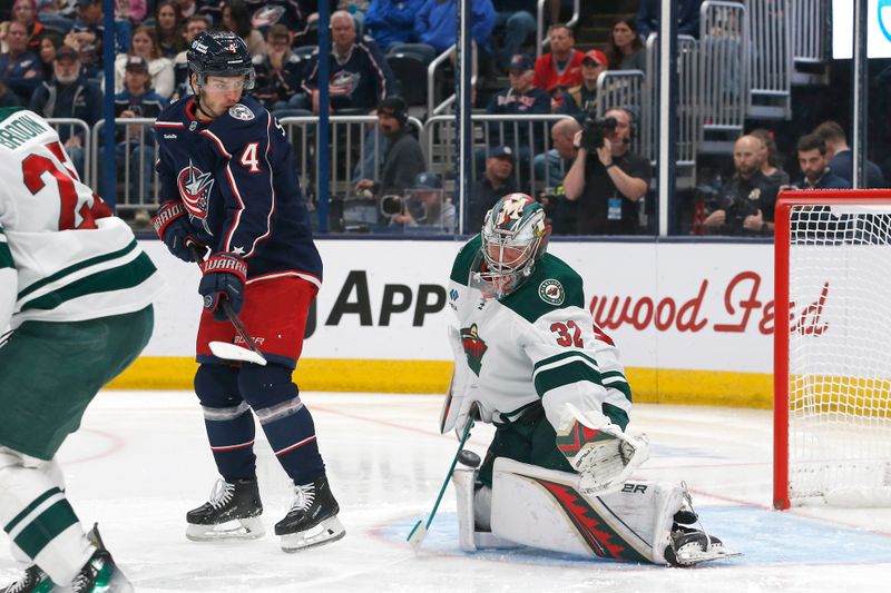 Oct 19, 2024; Columbus, Ohio, USA; Minnesota Wild goalie Filip Gustavsson (32) makes a save against the Columbus Blue Jackets during the second period  at Nationwide Arena. Mandatory Credit: Russell LaBounty-Imagn Images