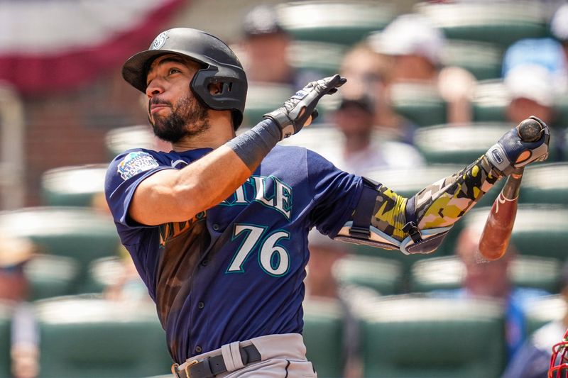 May 21, 2023; Cumberland, Georgia, USA; Seattle Mariners second baseman Jose Caballero (76) hits a home run against the Atlanta Braves during the eighth inning at Truist Park. Mandatory Credit: Dale Zanine-USA TODAY Sports