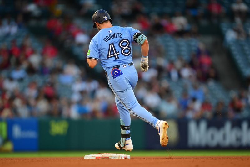 Aug 13, 2024; Anaheim, California, USA; Toronto Blue Jays designated hitter Spencer Horwitz (48) runs the bases after hitting a solo home run against the Los Angeles Angels during the third inning at Angel Stadium. Mandatory Credit: Gary A. Vasquez-USA TODAY Sports