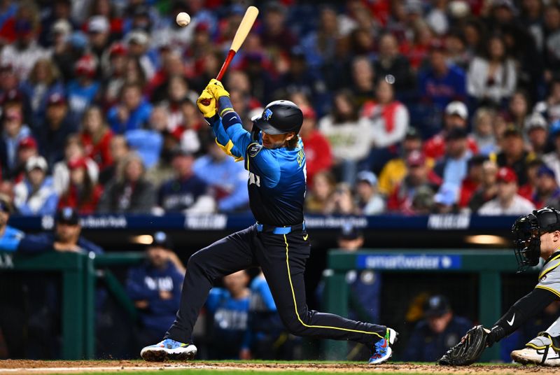 Apr 12, 2024; Philadelphia, Pennsylvania, USA; Philadelphia Phillies second baseman Bryson Stott (5) hits an RBI infield single against the Pittsburgh Pirates in the fifth inning at Citizens Bank Park. Mandatory Credit: Kyle Ross-USA TODAY Sports