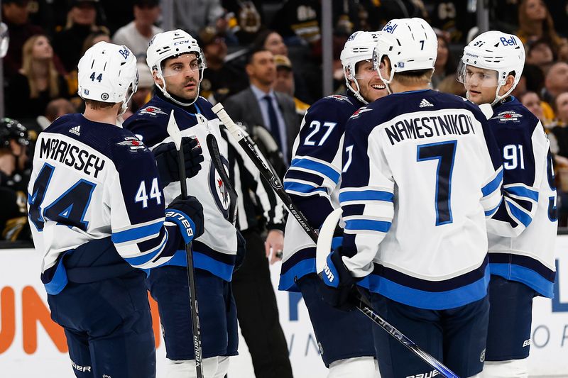 Jan 22, 2024; Boston, Massachusetts, USA; Winnipeg Jets defenseman Dylan DeMelo (2) is congratulated by teammates after his goal against the Boston Bruins during the first period at TD Garden. Mandatory Credit: Winslow Townson-USA TODAY Sports