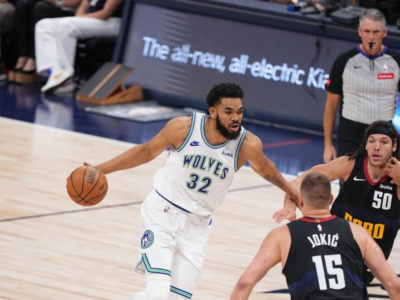 DENVER, CO - MAY 19: Karl-Anthony Towns #32 of the Minnesota Timberwolves handles the ball during the game  against the Denver Nuggets during Round 2 Game 7 of the 2024 NBA Playoffs on May 19, 2024 at the Ball Arena in Denver, Colorado. NOTE TO USER: User expressly acknowledges and agrees that, by downloading and/or using this Photograph, user is consenting to the terms and conditions of the Getty Images License Agreement. Mandatory Copyright Notice: Copyright 2023 NBAE (Photo by Bart Young/NBAE via Getty Images)