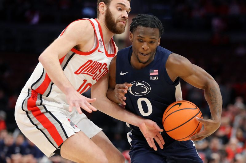 Jan 20, 2024; Columbus, Ohio, USA;  Penn State Nittany Lions guard Kanye Clary (0) controls the ball  as Ohio State Buckeyes forward Jamison Battle (10) defends during the first half at Value City Arena. Mandatory Credit: Joseph Maiorana-USA TODAY Sports