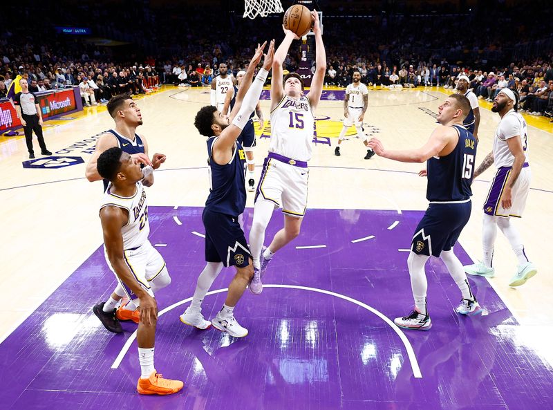 LOS ANGELES, CALIFORNIA - APRIL 27:  Austin Reaves #15 of the Los Angeles Lakers takes a shot against the Denver Nuggets in the first half during game four of the Western Conference First Round Playoffs at Crypto.com Arena on April 27, 2024 in Los Angeles, California.  NOTE TO USER: User expressly acknowledges and agrees that, by downloading and/or using this photograph, user is consenting to the terms and conditions of the Getty Images License Agreement. (Photo by Ronald Martinez/Getty Images)