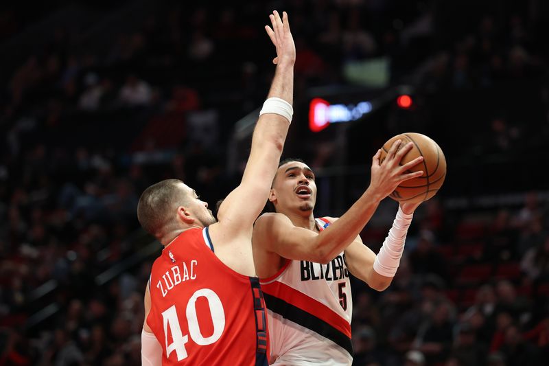 PORTLAND, OREGON - JANUARY 16: Ivica Zubac #40 of the LA Clippers defends Dalano Banton #5 of the Portland Trail Blazers during the second half at Moda Center on January 16, 2025 in Portland, Oregon. NOTE TO USER: User expressly acknowledges and agrees that, by downloading and or using this photograph, User is consenting to the terms and conditions of the Getty Images License Agreement. (Photo by Steph Chambers/Getty Images)