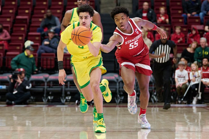 Jan 21, 2023; Stanford, California, USA; Oregon Ducks guard Will Richardson (0) brings the ball up court against Stanford Cardinal forward Harrison Ingram (55) during the first half at Maples Pavilion. Mandatory Credit: Robert Edwards-USA TODAY Sports