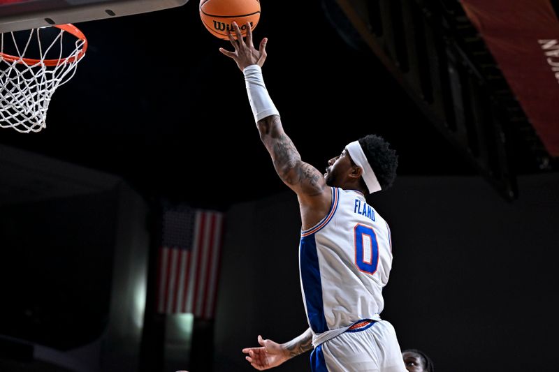 Feb 7, 2026; College Station, Texas, USA; Florida Gators guard Boogie Fland (0) lays up the ball against the Texas A&M Aggies during the first half at Reed Arena. Mandatory Credit: Maria Lysaker-Imagn Images 