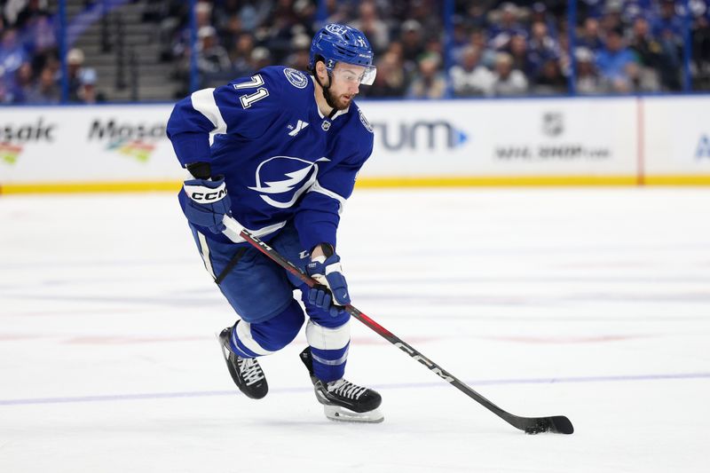 Mar 4, 2025; Tampa, Florida, USA; Tampa Bay Lightning center Anthony Cirelli (71) controls the puck against the Columbus Blue Jackets in the second period at Amalie Arena. Mandatory Credit: Nathan Ray Seebeck-Imagn Images