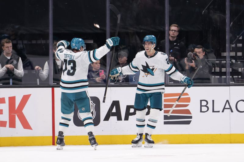 Oct 28, 2024; Salt Lake City, Utah, USA;  San Jose Sharks center Alexander Wennberg (21) celebrates after scoring the game winning goal during over-time against the Utah Hockey Club at Delta Center. Mandatory Credit: Chris Nicoll-Imagn Images