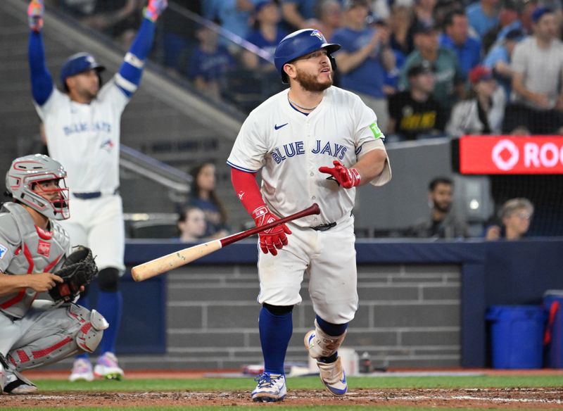 Jun 4, 2025; Toronto, Ontario, CAN;  Toronto Blue Jays catcher Alejandro Kirk (30) hits a walkoff RBI double against the Philadelphia Phillies in the ninth inning at Rogers Centre. Mandatory Credit: Dan Hamilton-Imagn Images