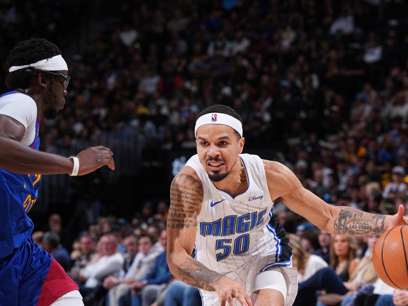 DENVER, CO - JANUARY 5: Cole Anthony #50 of the Orlando Magic dribbles the ball during the game against the Denver Nuggets on January 5, 2024 at the Ball Arena in Denver, Colorado. NOTE TO USER: User expressly acknowledges and agrees that, by downloading and/or using this Photograph, user is consenting to the terms and conditions of the Getty Images License Agreement. Mandatory Copyright Notice: Copyright 2024 NBAE (Photo by Garrett Ellwood/NBAE via Getty Images)