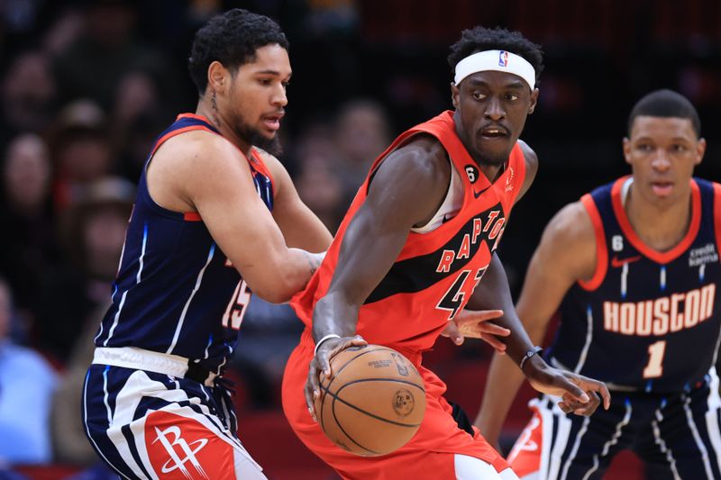 HOUSTON, TEXAS - FEBRUARY 03: Pascal Siakam #43 of the Toronto Raptors controls the ball ahead of Daishen Nix #15 of the Houston Rockets during the first half at Toyota Center on February 03, 2023 in Houston, Texas. NOTE TO USER: User expressly acknowledges and agrees that, by downloading and or using this photograph, User is consenting to the terms and conditions of the Getty Images License Agreement. (Photo by Carmen Mandato/Getty Images)