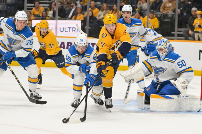 Dec 11, 2025; Nashville, Tennessee, USA;  Nashville Predators right wing Matthew Wood (71) and St. Louis Blues left wing Hugh McGing (56) battle for the puck in front of the net during the first period at Bridgestone Arena. Mandatory Credit: Steve Roberts-Imagn Images