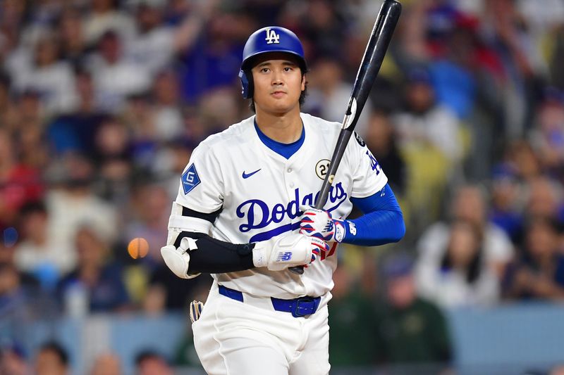 Sep 15, 2025; Los Angeles, California, USA; Los Angeles Dodgers two-way player Shohei Ohtani (17) steps into to bat against the Philadelphia Phillies in the first inning at Dodger Stadium. Mandatory Credit: Gary A. Vasquez-Imagn Images