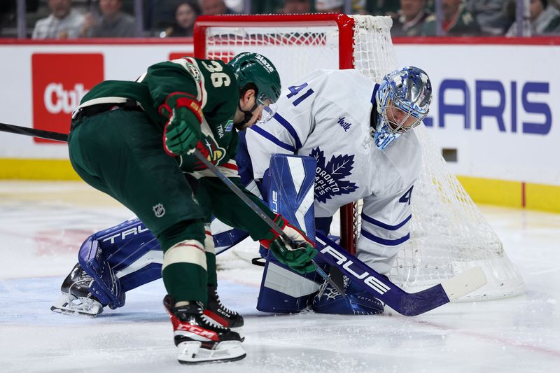 Mar 15, 2026; Saint Paul, Minnesota, USA; Toronto Maple Leafs goaltender Dennis Hildeby (41) defends his net against Minnesota Wild right wing Mats Zuccarello (36) during the second period at Grand Casino Arena. Mandatory Credit: Matt Krohn-Imagn Images