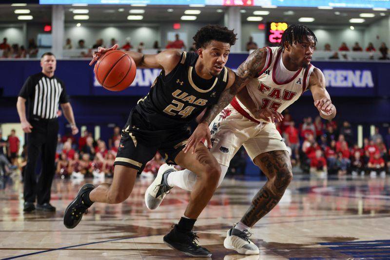 Jan 14, 2024; Boca Raton, Florida, USA; UAB Blazers guard Efrem Johnson (24) drives to the basket against Florida Atlantic Owls guard Alijah Martin (15) during the first half at Eleanor R. Baldwin Arena. Mandatory Credit: Sam Navarro-USA TODAY Sports