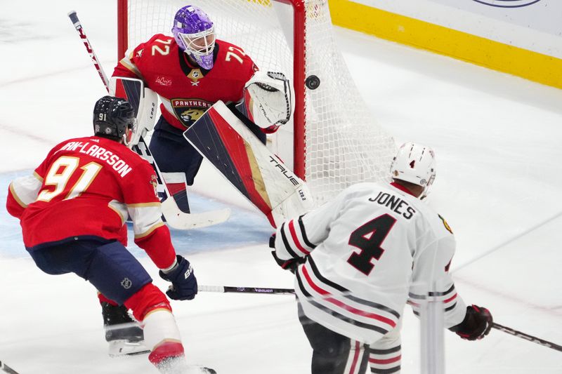 Nov 12, 2023; Sunrise, Florida, USA; Chicago Blackhawks defenseman Seth Jones (4) hits the post on his shot against Florida Panthers goaltender Sergei Bobrovsky (72) during the third period at Amerant Bank Arena. Mandatory Credit: Jasen Vinlove-USA TODAY Sports