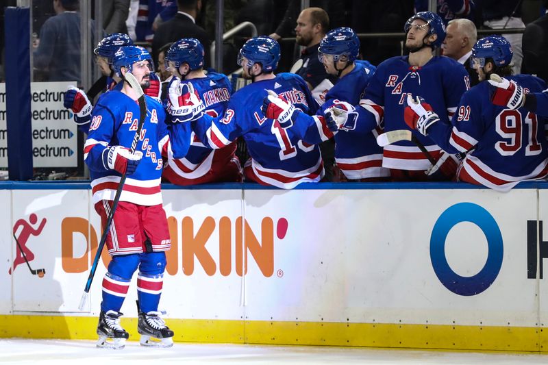 Nov 13, 2022; New York, New York, USA;  New York Rangers left wing Chris Kreider (20) is greeted by his teammates after scoring a goal in the third period against the Arizona Coyotes at Madison Square Garden. Mandatory Credit: Wendell Cruz-USA TODAY Sports