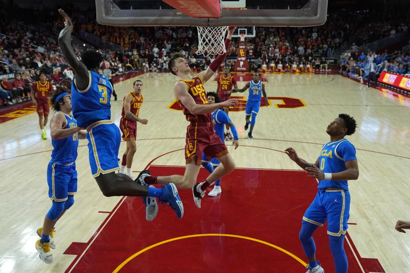 Jan 26, 2023; Los Angeles, California, USA; Southern California Trojans guard Drew Peterson (13) shoots the ball against the UCLA Bruins in the second half at Galen Center. Mandatory Credit: Kirby Lee-USA TODAY Sports