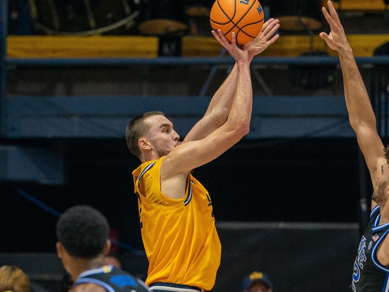 Jan 14, 2026; Berkeley, California, USA; California Golden Bears forward John Camden (2) shoots a three point shot against Duke Blue Devils forward Cameron Boozer (12) during the first half at Haas Pavilion. Mandatory Credit: Neville E. Guard-Imagn Images