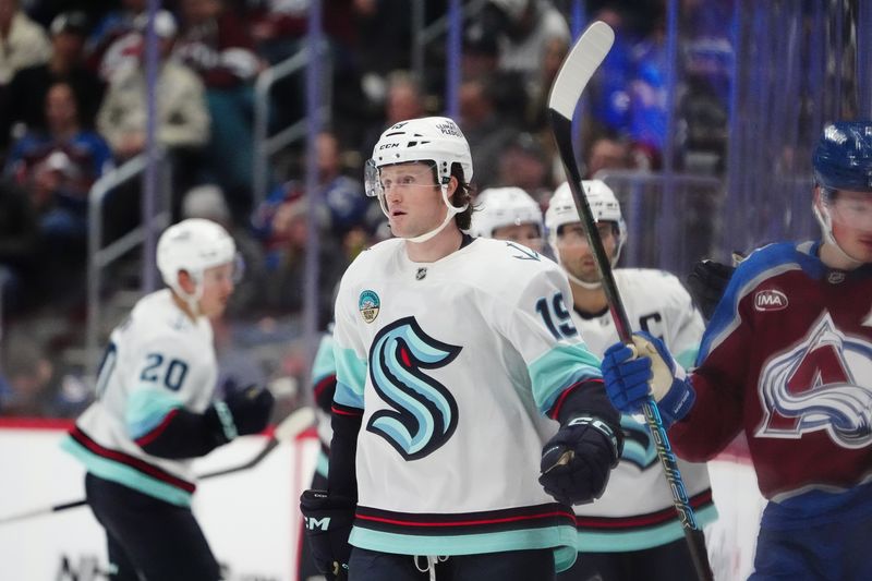 Nov 5, 2024; Denver, Colorado, USA; Seattle Kraken left wing Jared McCann (19) celebrates a goal in the second period against the Colorado Avalanche at Ball Arena. Mandatory Credit: Ron Chenoy-Imagn Images