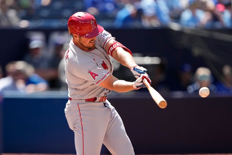 Jul 30, 2023; Toronto, Ontario, CAN; Los Angeles Angels right fielder Hunter Renfroe (12) hits the game winning two run home run during the tenth inning against the Toronto Blue Jays at Rogers Centre. Mandatory Credit: John E. Sokolowski-USA TODAY Sports