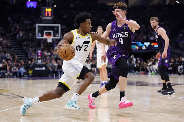 SACRAMENTO, CALIFORNIA - DECEMBER 16: Collin Sexton #2 of the Utah Jazz drives to the basket against Kevin Huerter #9 of the Sacramento Kings in the second quarter at Golden 1 Center on December 16, 2023 in Sacramento, California. NOTE TO USER: User expressly acknowledges and agrees that, by downloading and or using this photograph, User is consenting to the terms and conditions of the Getty Images License Agreement. (Photo by Lachlan Cunningham/Getty Images)