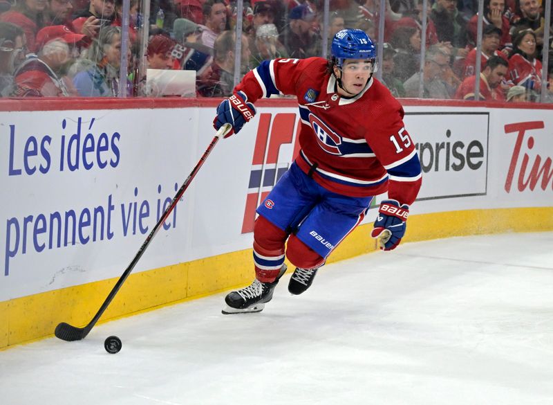 Feb 10, 2024; Montreal, Quebec, CAN; Montreal Canadiens forward Alex Newhook (15) controls the puck against the Dallas Stars during the third period at the Bell Centre. Mandatory Credit: Eric Bolte-USA TODAY Sports