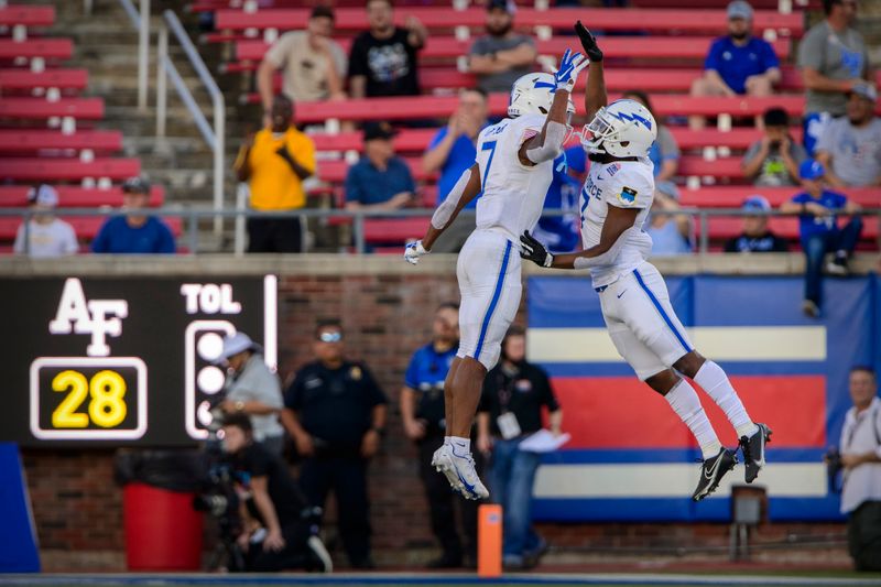 Dec 28, 2021; Dallas, Texas, USA; Air Force Falcons safety Trey Taylor (7) and cornerback Zion Kelly (17) celebrate a defensive fourth down stop against the Louisville Cardinals during the second half during the 2021 First Responder Bowl at Gerald J. Ford Stadium. Mandatory Credit: Jerome Miron-USA TODAY Sports