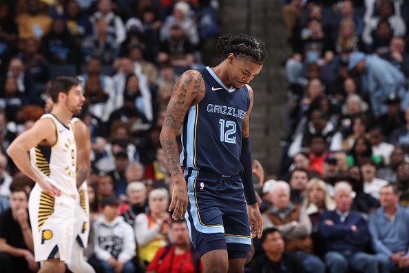 MEMPHIS, TN - DECEMBER 21: Ja Morant #12 of the Memphis Grizzlies looks on during the game against the Indiana Pacers on December 21, 2023 at FedExForum in Memphis, Tennessee. NOTE TO USER: User expressly acknowledges and agrees that, by downloading and or using this photograph, User is consenting to the terms and conditions of the Getty Images License Agreement. Mandatory Copyright Notice: Copyright 2023 NBAE (Photo by Joe Murphy/NBAE via Getty Images)