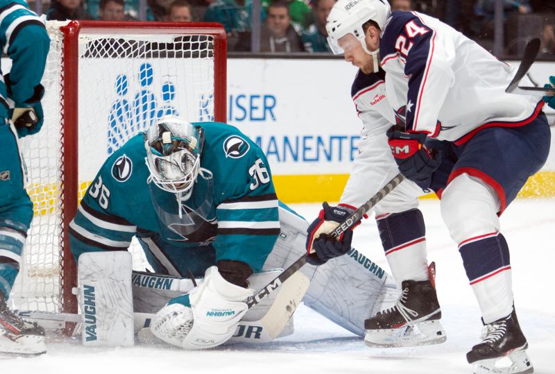 Mar 14, 2023; San Jose, California, USA; San Jose Sharks goaltender Kaapo Kahkonen (36) makes the save on a shot by Columbus Blue Jackets right winger Mathieu Olivier (24) during the first period at SAP Center at San Jose. Mandatory Credit: D. Ross Cameron-USA TODAY Sports