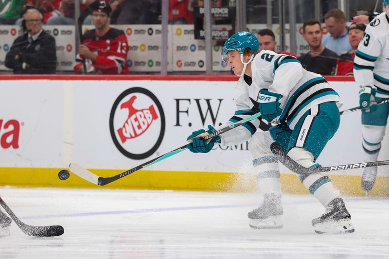 Oct 24, 2025; Newark, New Jersey, USA; San Jose Sharks center Will Smith (2) plays the puck against the New Jersey Devils during the first period at Prudential Center. Mandatory Credit: Ed Mulholland-Imagn Images