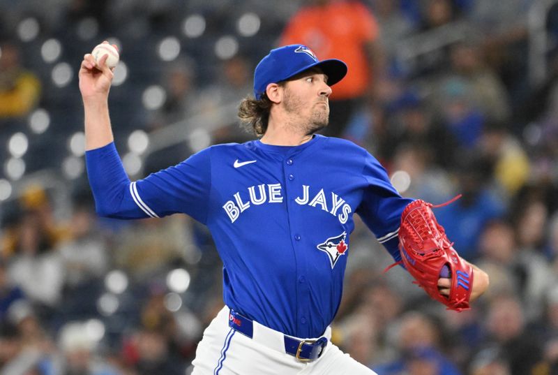 May 21, 2025; Toronto, Ontario, CAN;  Toronto Blue Jays starting pitcher Kevin Gausman (34) delivers a pitch against the San Diego Padres in the first inning at Rogers Centre. Mandatory Credit: Dan Hamilton-Imagn Images