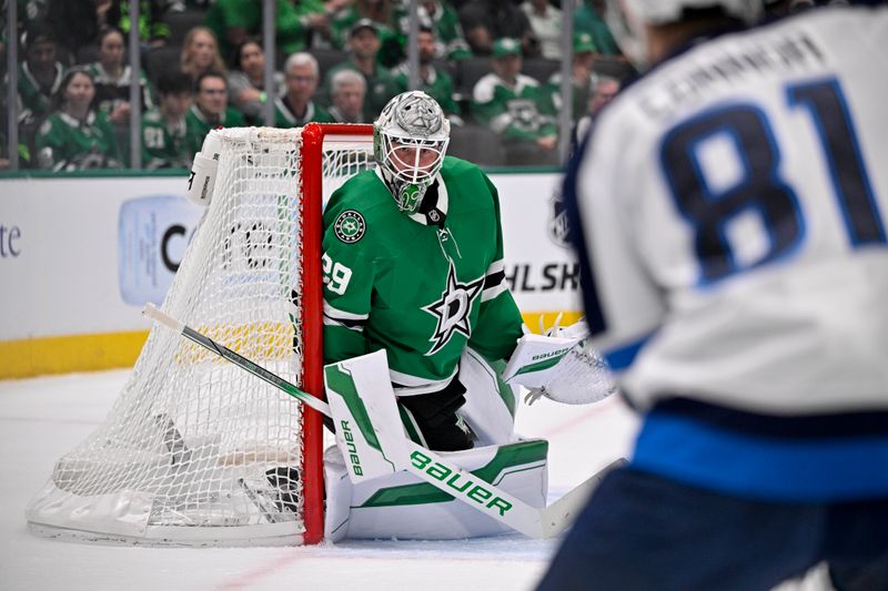 May 13, 2025; Dallas, Texas, USA; Dallas Stars goaltender Jake Oettinger (29) faces a shot from Winnipeg Jets left wing Kyle Connor (81) during the first period in game four of the second round of the 2025 Stanley Cup Playoffs at American Airlines Center. Mandatory Credit: Jerome Miron-Imagn Images