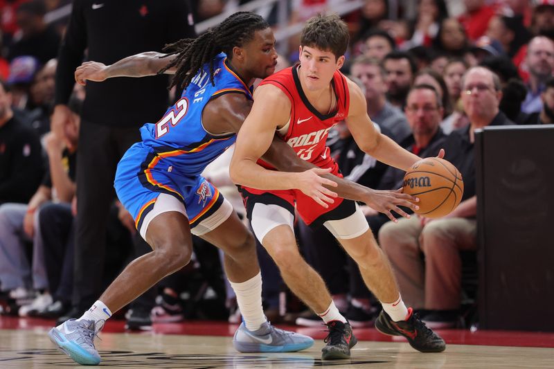 HOUSTON, TEXAS - DECEMBER 01: Reed Sheppard #15 of the Houston Rockets draws a foul from Cason Wallace #22 of the Oklahoma City Thunder during the second half at Toyota Center on December 01, 2024 in Houston, Texas. NOTE TO USER: User expressly acknowledges and agrees that, by downloading and or using this photograph, User is consenting to the terms and conditions of the Getty Images License Agreement. (Photo by Alex Slitz/Getty Images)