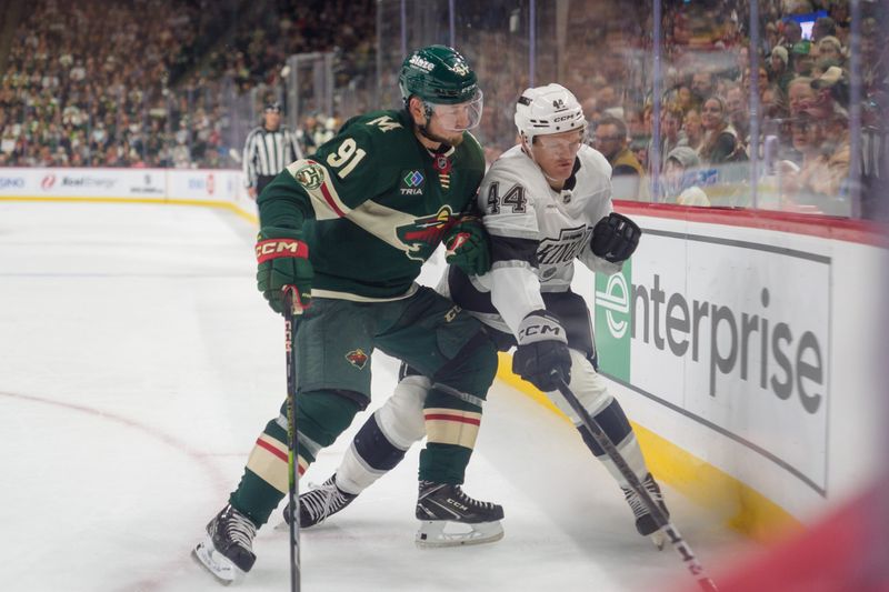 Oct 13, 2025; Saint Paul, Minnesota, USA; Minnesota Wild right wing Vladimir Tarasenko (91) checks Los Angeles Kings defenseman Mikey Anderson (44) in the third period at Grand Casino Arena. Mandatory Credit: Matt Blewett-Imagn Images