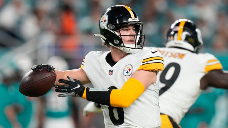 Pittsburgh Steelers quarterback Kenny Pickett (8) aims a pass during the first half of an NFL football game against the Miami Dolphins, Sunday, Oct. 23, 2022, in Miami Gardens, Fla. (AP Photo/Rebecca Blackwell)