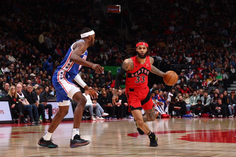 TORONTO, CANADA - MARCH 31: Gary Trent Jr. #33 of the Toronto Raptors dribbles the ball during the game against the Philadelphia 76ers on March 31, 2024 at the Scotiabank Arena in Toronto, Ontario, Canada.  NOTE TO USER: User expressly acknowledges and agrees that, by downloading and or using this Photograph, user is consenting to the terms and conditions of the Getty Images License Agreement.  Mandatory Copyright Notice: Copyright 2024 NBAE (Photo by Vaughn Ridley/NBAE via Getty Images)