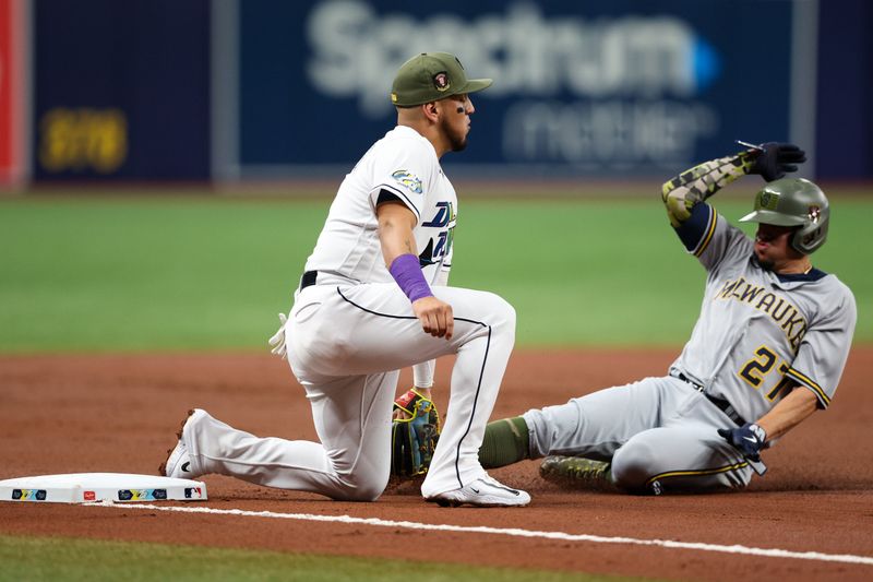 May 19, 2023; St. Petersburg, Florida, USA;  Milwaukee Brewers shortstop Willy Adames (27) is tagged out at third base by Tampa Bay Rays third baseman Isaac Paredes (17) in the second inning at Tropicana Field. Mandatory Credit: Nathan Ray Seebeck-USA TODAY Sports