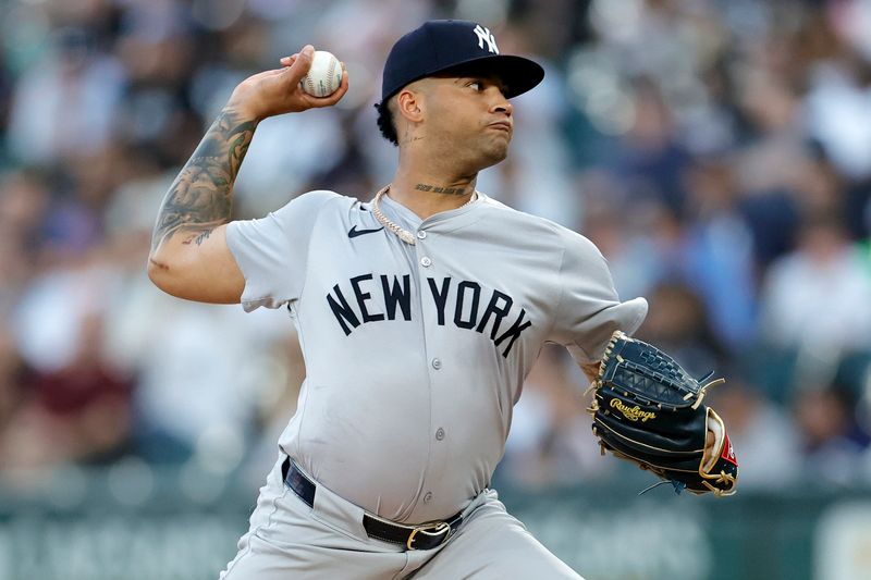 Aug 12, 2024; Chicago, Illinois, USA; New York Yankees pitcher Luis Gil (81) throws pitch against the Chicago White Sox during the first inning at Guaranteed Rate Field. Mandatory Credit: Kamil Krzaczynski-USA TODAY Sports