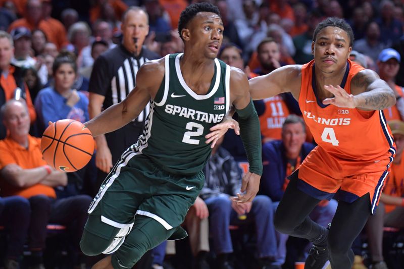 Jan 11, 2024; Champaign, Illinois, USA;  Michigan State Spartans guard Tyson Walker (2) drives the ball past Illinois Fighting Illini guard Justin Harmon (4) during the second half at State Farm Center. Mandatory Credit: Ron Johnson-USA TODAY Sports