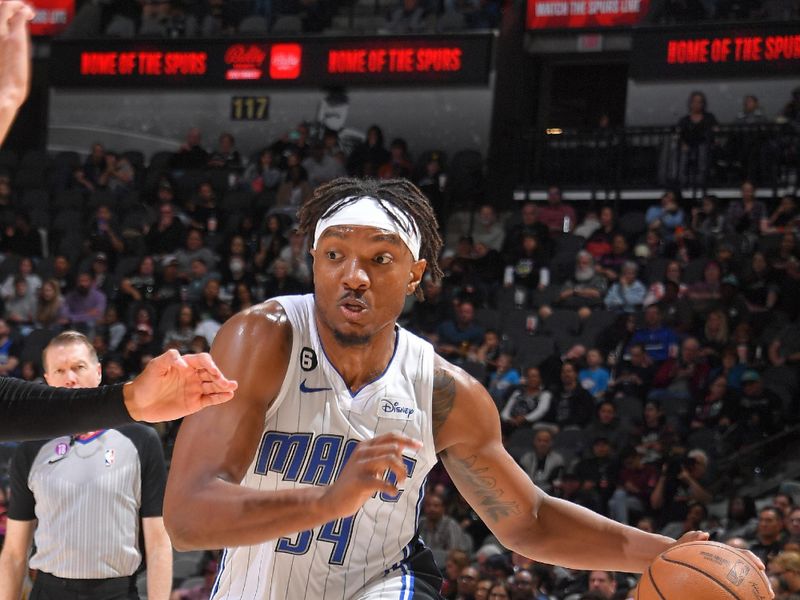 SAN ANTONIO, TX - MARCH 14: Wendell Carter Jr. #34 of the Orlando Magic drives to the basket during the game against the San Antonio Spurs on March 14, 2023 at the AT&T Center in San Antonio, Texas. NOTE TO USER: User expressly acknowledges and agrees that, by downloading and or using this photograph, user is consenting to the terms and conditions of the Getty Images License Agreement. Mandatory Copyright Notice: Copyright 2023 NBAE (Photos by Michael Gonzales/NBAE via Getty Images)