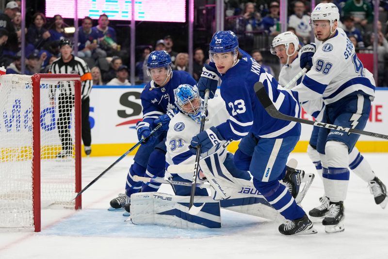 Nov 6, 2023; Toronto, Ontario, CAN; Toronto Maple Leafs forward Matthew Knies (23) goes after a rebound by Tampa Bay Lightning goaltender Jonas Johansson (31) during the first period at Scotiabank Arena. Mandatory Credit: John E. Sokolowski-USA TODAY Sports