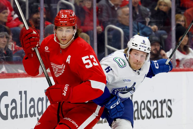 Dec 1, 2024; Detroit, Michigan, USA;  Detroit Red Wings defenseman Moritz Seider (53) and Vancouver Canucks right wing Brock Boeser (6) fight for position in the first period at Little Caesars Arena. Mandatory Credit: Rick Osentoski-Imagn Images